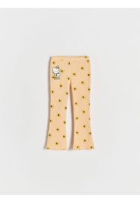 Reserved - Prążkowane legginsy Hello Kitty - brzoskwiniowy. Kolor: pomarańczowy. Materiał: prążkowany. Wzór: motyw z bajki #1
