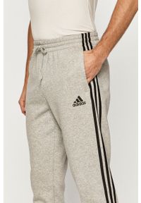 Adidas - adidas - Spodnie. Kolor: szary. Materiał: dzianina