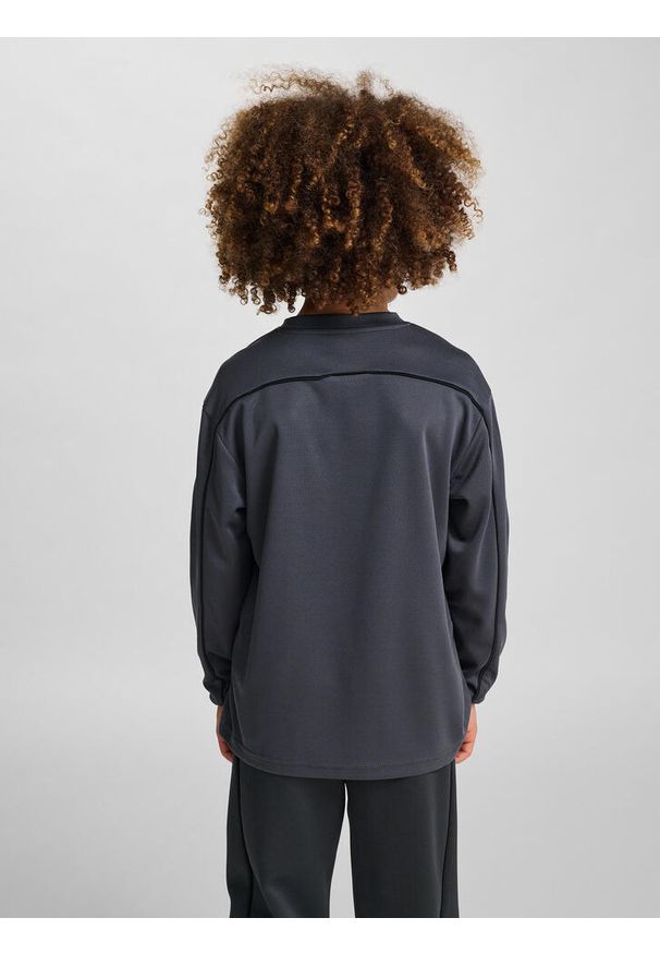 Dziecięcy dżersej z długim rękawem Hummel. Kolor: wielokolorowy, szary, czarny, brązowy. Materiał: jersey. Długość rękawa: długi rękaw. Długość: długie. Styl: młodzieżowy