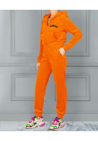CHAOS BY MARTA BOLIGLOVA - Welurowe pomarańczowe spodnie dresowe GOTHIC. Kolor: wielokolorowy, fioletowy, różowy. Materiał: welur, dresówka. Wzór: aplikacja, haft