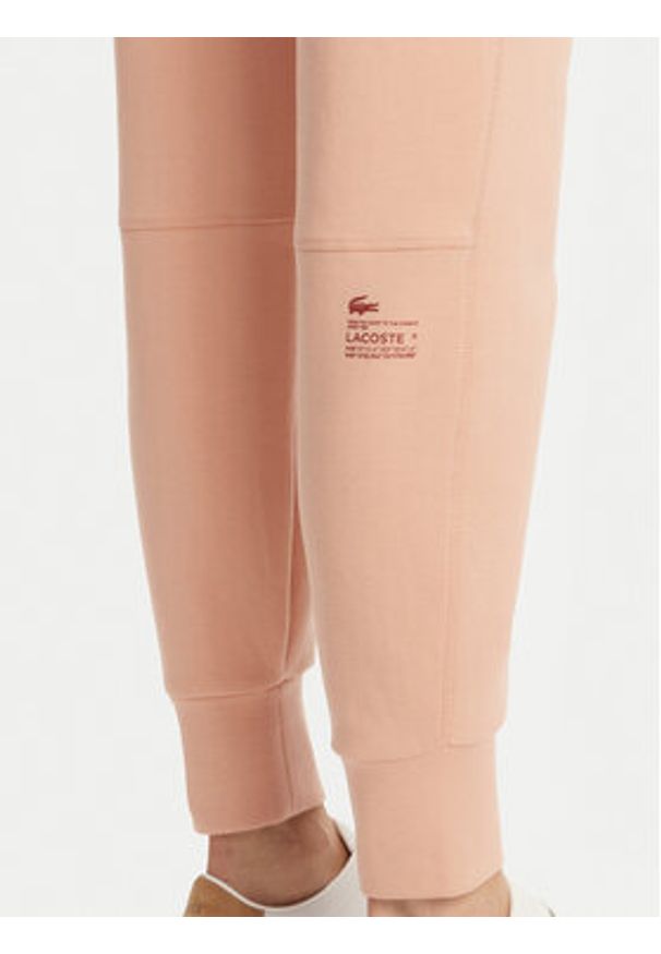 Lacoste Spodnie dresowe XF0343 Pomarańczowy Regular Fit. Kolor: pomarańczowy. Materiał: bawełna