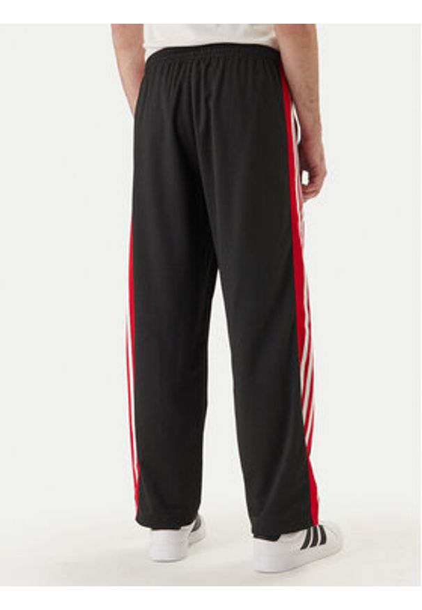 Adidas - adidas Spodnie dresowe KE0117 Czarny Loose Fit. Kolor: czarny. Materiał: syntetyk