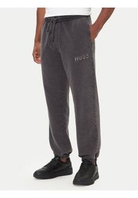 Hugo - HUGO Spodnie dresowe Delwony 50546385 Szary Relaxed Fit. Kolor: szary. Materiał: bawełna #1