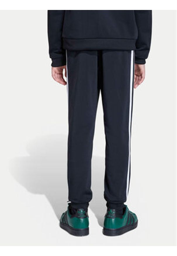 Adidas - adidas Spodnie dresowe adicolor SST KE2862 Czarny Regular Fit. Kolor: czarny. Materiał: syntetyk