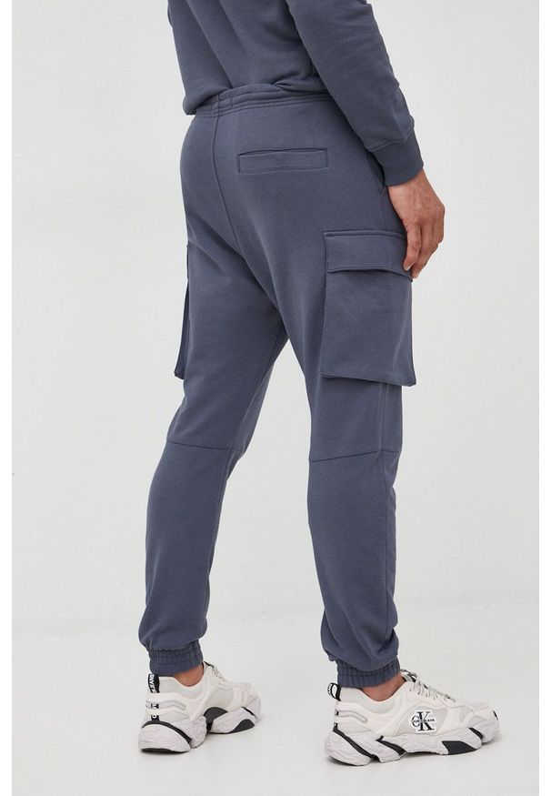 G-Star RAW - G-Star Raw spodnie dresowe męskie kolor granatowy gładkie. Kolor: niebieski. Materiał: dresówka. Wzór: gładki