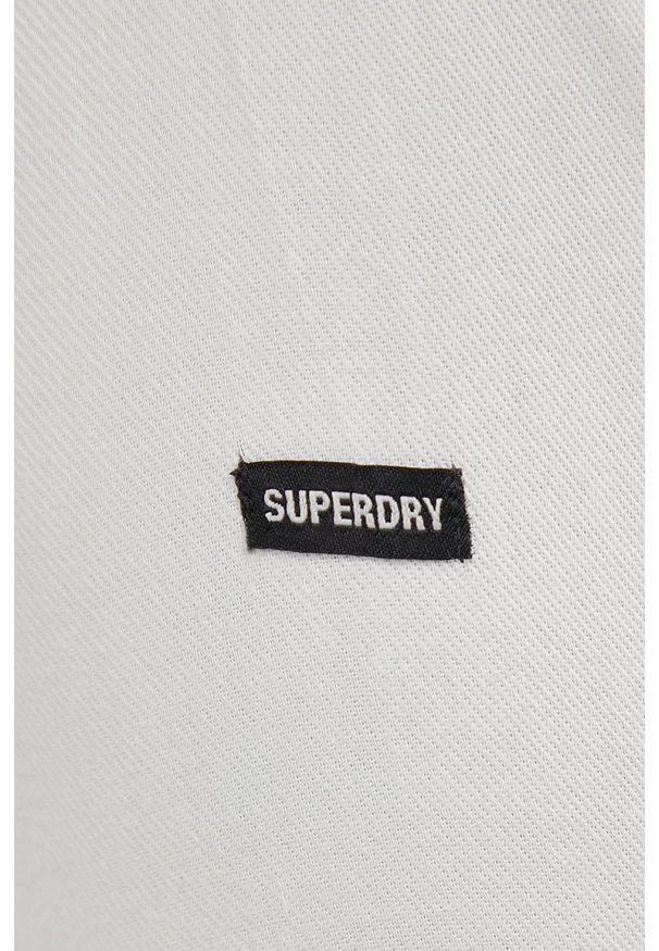 Superdry Koszula bawełniana męska kolor kremowy regular z kołnierzykiem klasycznym. Okazja: na co dzień. Typ kołnierza: kołnierzyk klasyczny. Kolor: beżowy. Materiał: bawełna. Długość rękawa: długi rękaw. Długość: długie. Styl: klasyczny