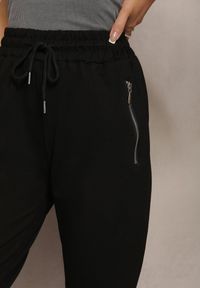 Renee - Czarne Dresowe Spodnie Bawełniane Joggery z Kieszeniami na Suwaki Bieitta. Kolor: czarny. Materiał: dresówka, bawełna
