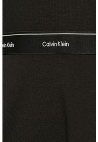 Calvin Klein - Sukienka. Okazja: na co dzień. Kolor: czarny. Materiał: materiał, dzianina, wiskoza, elastan, poliester. Wzór: nadruk. Typ sukienki: rozkloszowane, proste. Styl: casual. Długość: mini #7