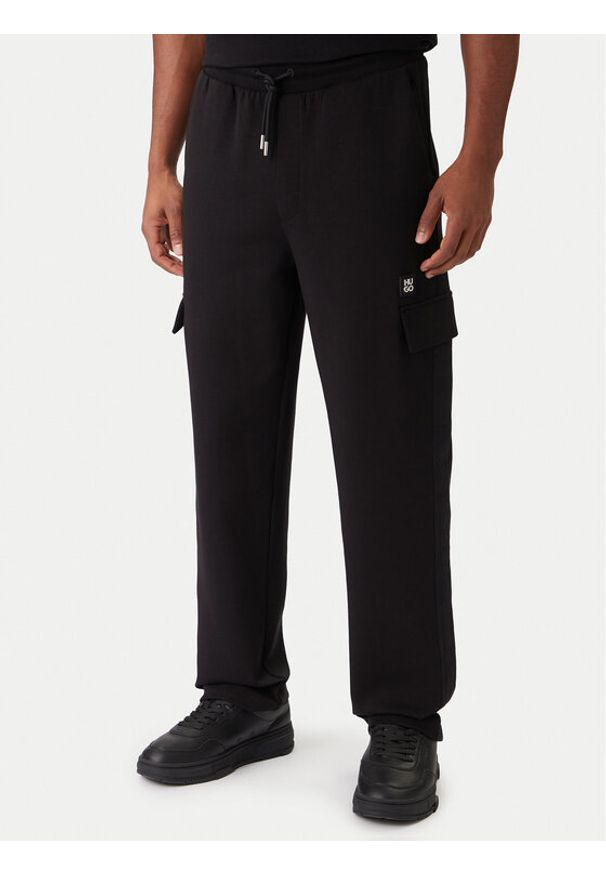 Hugo - HUGO Spodnie dresowe Danovopan 50546376 Czarny Relaxed Fit. Kolor: czarny. Materiał: bawełna