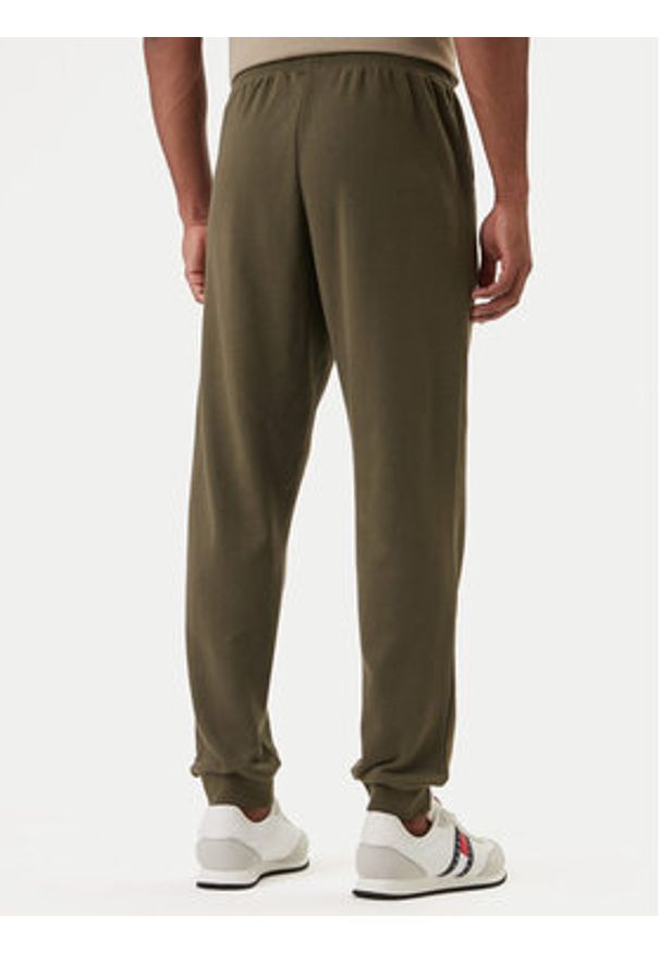TOMMY HILFIGER - Tommy Hilfiger Spodnie dresowe UM0UM03664 Khaki Regular Fit. Kolor: brązowy. Materiał: syntetyk