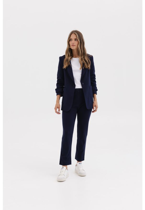 SPODNIE NANCY GRANATOWE S - Flawless. Okazja: na spotkanie biznesowe. Kolor: niebieski. Materiał: guma, skóra. Styl: klasyczny, elegancki, sportowy, biznesowy