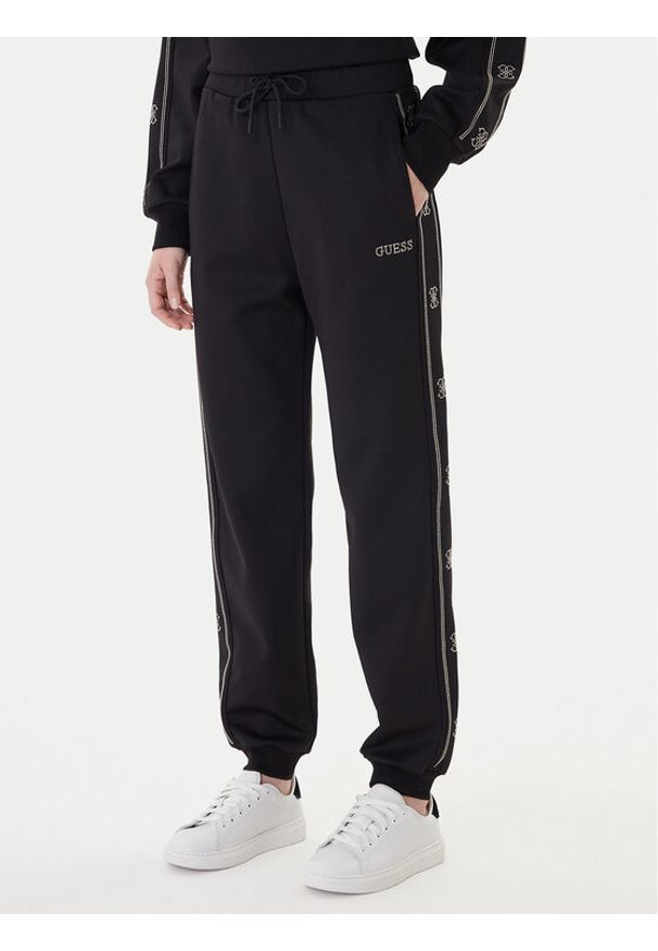 Guess Spodnie dresowe V5BB23 KCX22 Czarny Wide Leg. Kolor: czarny. Materiał: syntetyk