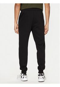 Champion Spodnie dresowe 220299 Czarny Slim Fit. Kolor: czarny. Materiał: syntetyk, bawełna