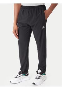 Adidas - adidas Spodnie dresowe Training Essentials Holiday JM5441 Czarny Regular Fit. Kolor: czarny. Materiał: syntetyk