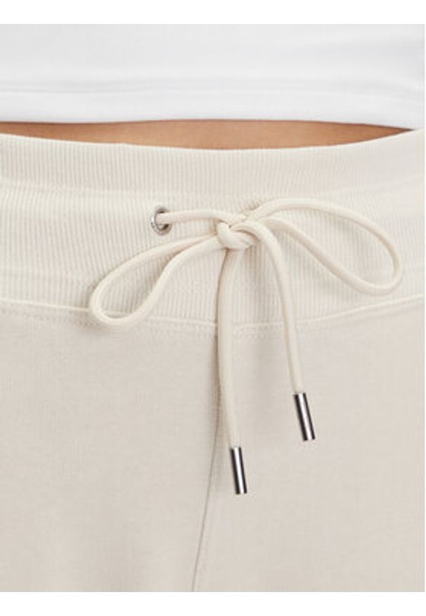 DKNY Sport Spodnie dresowe DP5P3624 Beżowy Regular Fit. Kolor: beżowy. Materiał: bawełna