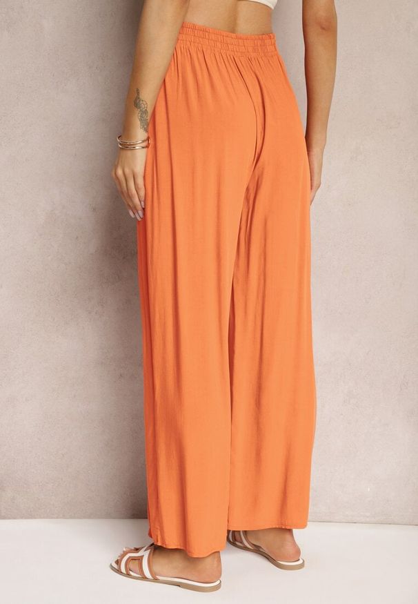 Renee - Pomarańczowe Szerokie Spodnie z Gumką i Wiązaniem w Pasie Gamina. Kolor: pomarańczowy. Sezon: wiosna, lato