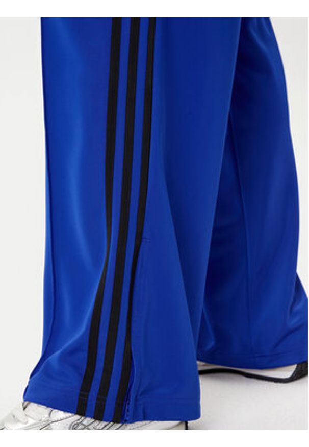 Adidas - adidas Spodnie dresowe adicolor Classic Firebird JY2693 Niebieski Loose Fit. Kolor: niebieski. Materiał: syntetyk