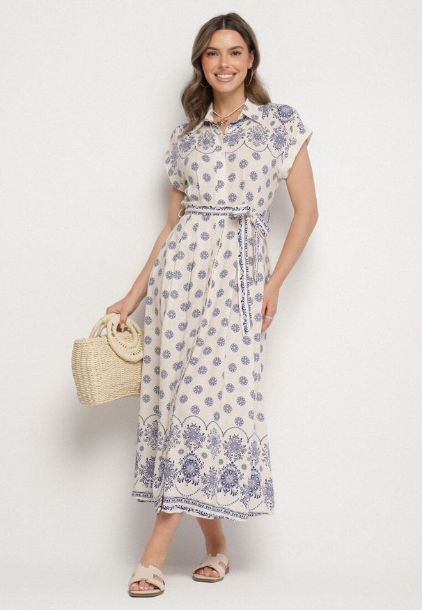 Born2be - Beżowo-Niebieska Koszulowa Sukienka z Wiskozy w Kwiatowy Wzór z Wiązanym Paskiem Iffinara. Okazja: na randkę, na spacer, na co dzień. Kolor: niebieski. Materiał: wiskoza. Długość rękawa: krótki rękaw. Wzór: kwiaty. Typ sukienki: koszulowe. Styl: klasyczny, casual, elegancki