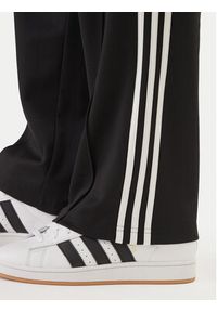 Adidas - adidas Spodnie dresowe adicolor KE3501 Czarny Loose Fit. Kolor: czarny. Materiał: bawełna #3
