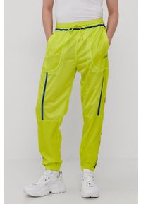 adidas Originals Spodnie dwustronne męskie kolor żółty gładkie. Kolor: żółty. Materiał: poliester. Wzór: gładki #8