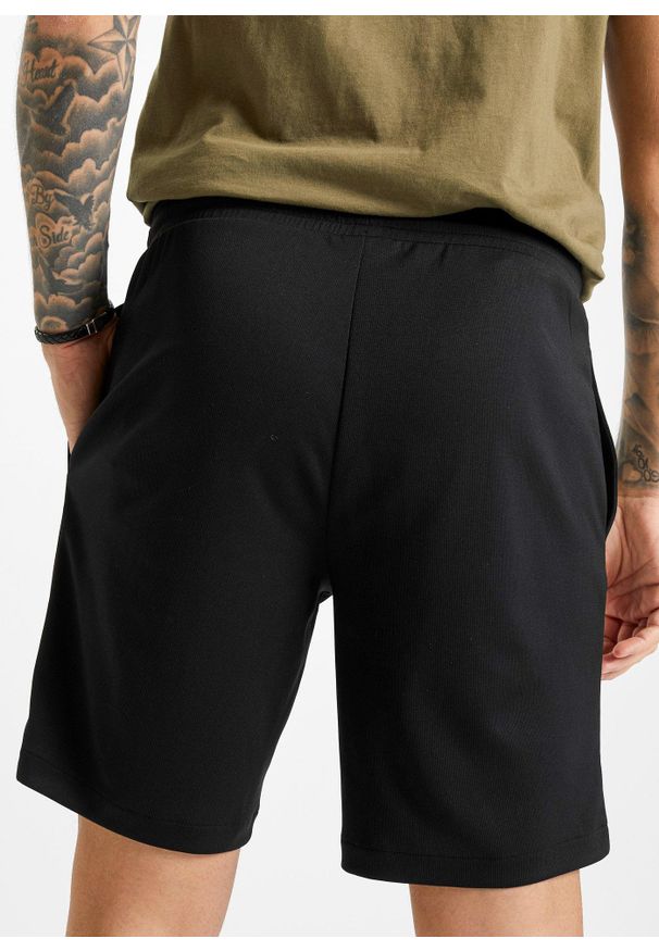 bonprix - Lekkie spodnie sportowe z materiału funkcjonalnego, krótkie nogawki. Kolor: czarny. Materiał: materiał. Długość: krótkie. Styl: sportowy