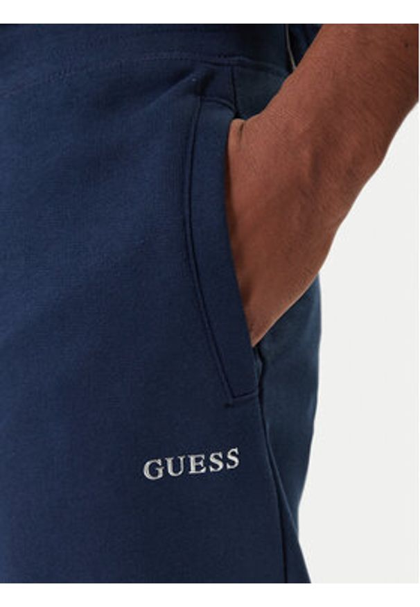 Guess Spodnie dresowe Z6RB12 KAIJ1 Granatowy Regular Fit. Kolor: niebieski. Materiał: bawełna