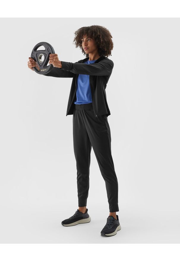 4f - 4F Spodnie treningowe szybkoschnące damskie - czarne XL. Kolor: czarny. Materiał: elastan, materiał, włókno, dzianina, syntetyk. Wzór: jednolity, ze splotem. Sport: fitness