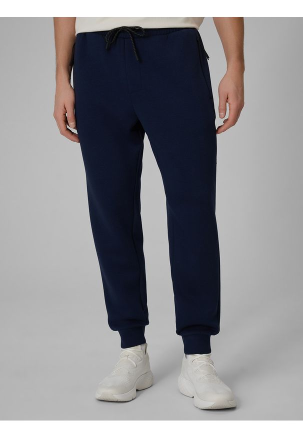 4f - 4F Spodnie dresowe joggery męskie - granatowe M. Kolor: niebieski. Materiał: dresówka. Sport: fitness