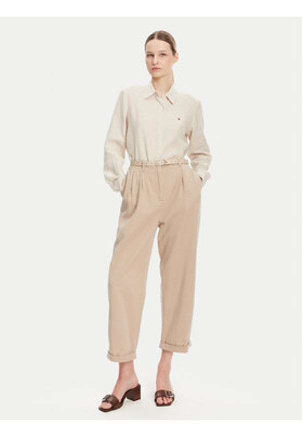 TOMMY HILFIGER - Tommy Hilfiger Spodnie materiałowe WW0WW45589 Beżowy Relaxed Fit. Kolor: beżowy. Materiał: bawełna