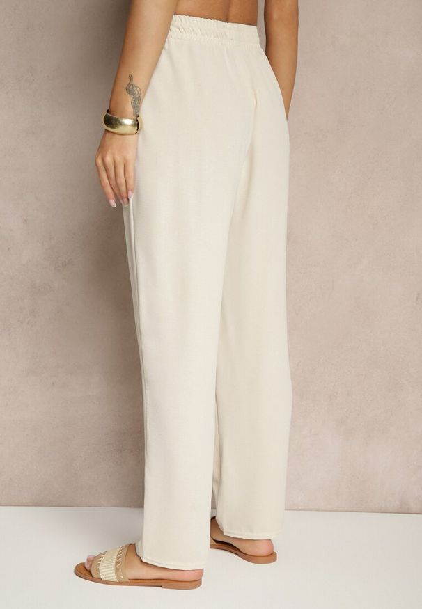 Renee - Jasnobeżowe Spodnie z Bawełną o Szerokim Kroju High Waist Fanelithia. Okazja: na co dzień. Stan: podwyższony. Kolor: beżowy. Materiał: bawełna. Styl: casual