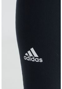 Adidas - adidas legginsy treningowe Yoga Essentials HD6803 damskie kolor czarny gładkie. Kolor: czarny. Materiał: skóra, dzianina, materiał. Wzór: gładki. Sport: fitness