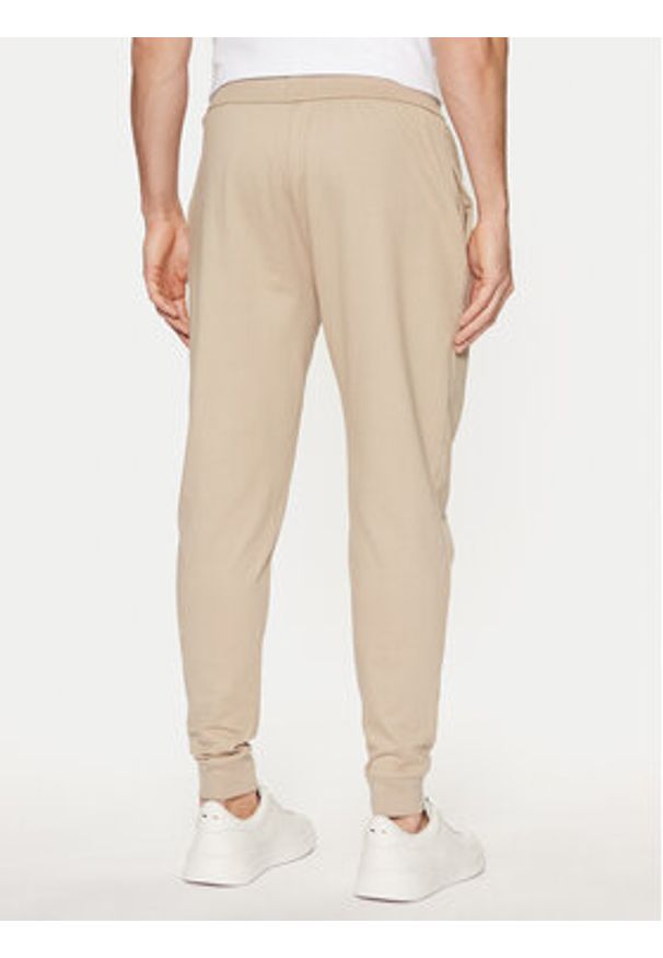BOSS Spodnie dresowe Authentic 50535813 Beżowy Regular Fit. Kolor: beżowy. Materiał: bawełna