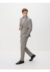 Reserved - Spodnie carrot slim w kratę - brązowy. Kolor: brązowy. Materiał: wiskoza, tkanina #1