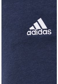 Adidas - adidas Spodnie damskie kolor granatowy gładkie. Kolor: niebieski. Materiał: dzianina, poliester, bawełna. Wzór: gładki