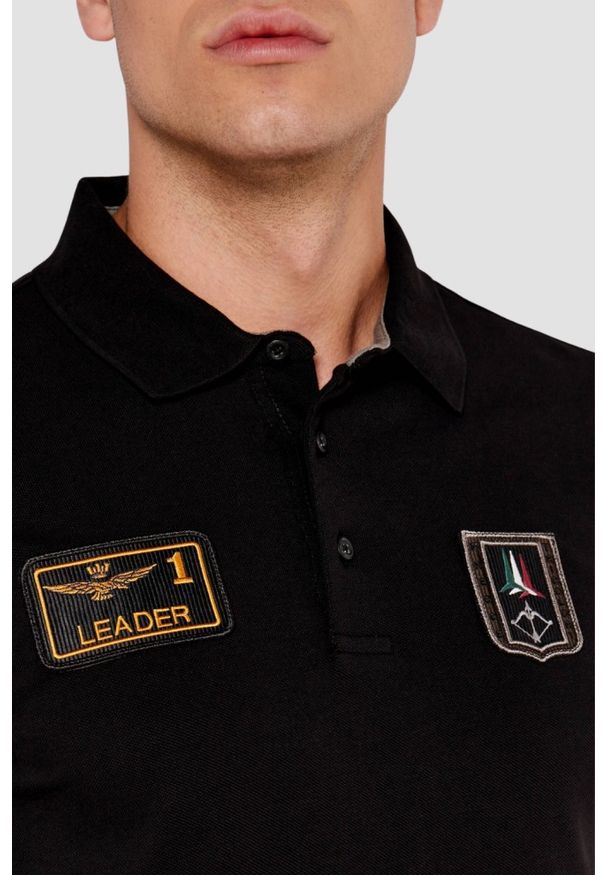 Aeronautica Militare - AERONAUTICA MILITARE Czarny męski longsleeve polo Piqué Patches, Rozmiar 3XL. Typ kołnierza: polo. Kolor: czarny. Materiał: bawełna. Długość rękawa: długi rękaw. Wzór: aplikacja. Styl: klasyczny