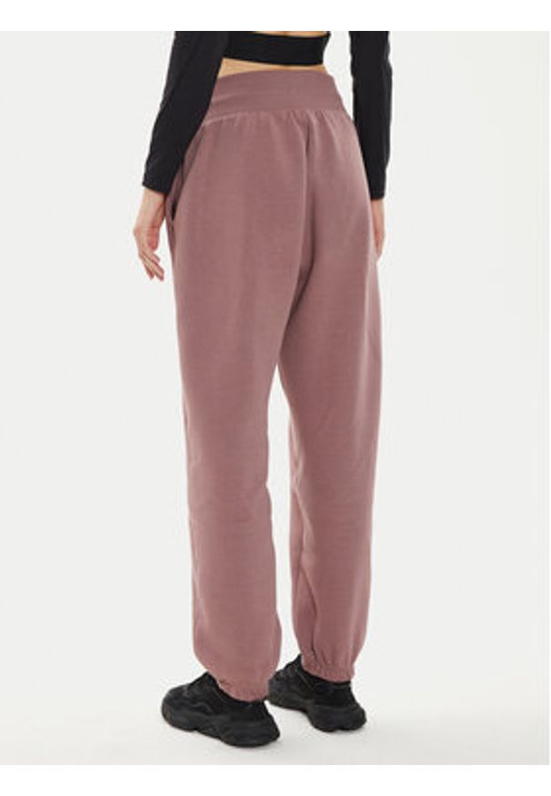 Nike Spodnie dresowe DQ5887 Różowy Oversize. Kolor: różowy. Materiał: bawełna