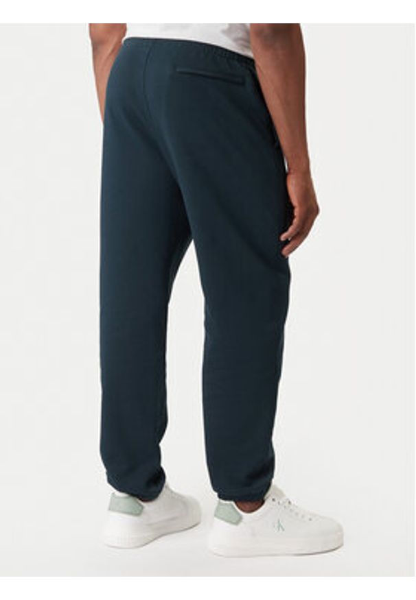 Calvin Klein Jeans Spodnie dresowe LV04RD241G Granatowy Regular Fit. Kolor: niebieski. Materiał: bawełna