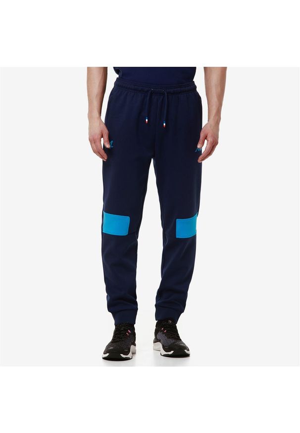 Kappa - Spodnie dresowe Alpine F1 Adrofin 2024. Kolor: wielokolorowy, niebieski, zielony. Materiał: dresówka. Długość: długie. Sport: bieganie