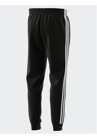 Adidas - adidas Spodnie dresowe IB4030 Czarny Regular Fit. Kolor: czarny. Materiał: bawełna #3