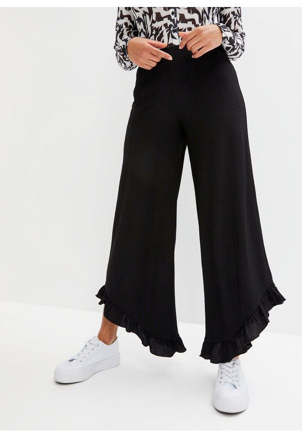 bonprix - Spodnie z gumką w talii z teksturowanej krepy. Kolor: czarny. Materiał: materiał