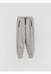 Reserved - Bawełniane spodnie jogger - jasnoszary. Kolor: szary. Materiał: bawełna