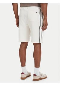 TOMMY HILFIGER - Tommy Hilfiger Szorty sportowe Crest Embroidery MW0MW42878 Beżowy jasny Relaxed Fit. Kolor: beżowy. Materiał: bawełna. Styl: sportowy #3