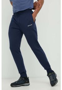 columbia - Columbia spodnie dresowe męskie kolor granatowy gładkie. Kolor: niebieski. Materiał: dresówka. Wzór: gładki #1