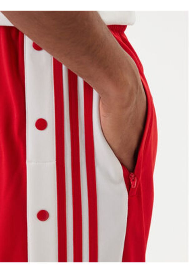 Adidas - adidas Spodnie dresowe Adibreak Classic KD4093 Czerwony Regular Fit. Kolor: czerwony. Materiał: syntetyk