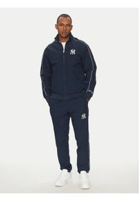 Champion Komplet dresowy 221238 Granatowy Regular Fit. Kolor: niebieski. Materiał: syntetyk
