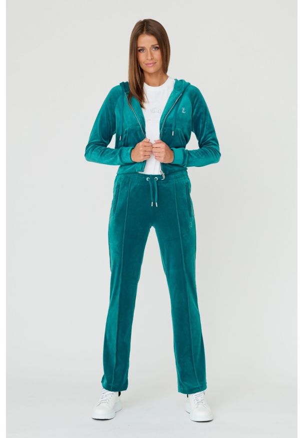 Juicy Couture - JUICY COUTURE Turkusowe damskie spodnie Tina, Rozmiar XS. Kolor: niebieski. Materiał: poliester, welur. Wzór: aplikacja