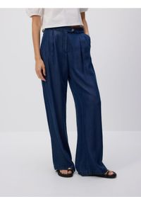 Reserved - Jeansy wide leg z lyocellu - granatowy. Kolor: niebieski