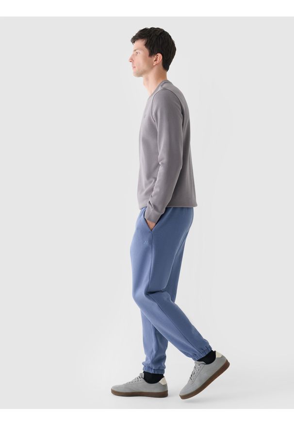 4f - 4F Spodnie dresowe joggery męskie - niebieskie XL. Kolor: niebieski. Materiał: dresówka. Wzór: gładki, ze splotem