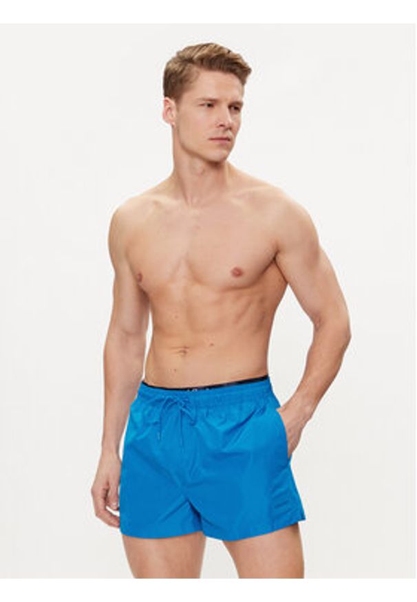 Calvin Klein Swimwear Szorty kąpielowe KM0KM00947 Niebieski Regular Fit. Kolor: niebieski. Materiał: syntetyk