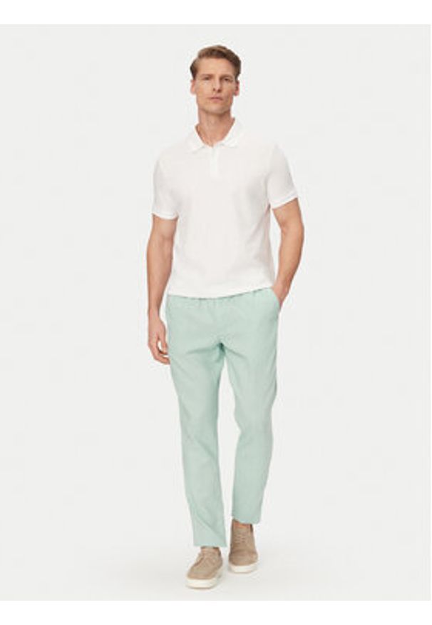 TOMMY HILFIGER - Tommy Hilfiger Chinosy Harlem MW0MW42336 Zielony jasny Regular Fit. Kolor: zielony. Materiał: len